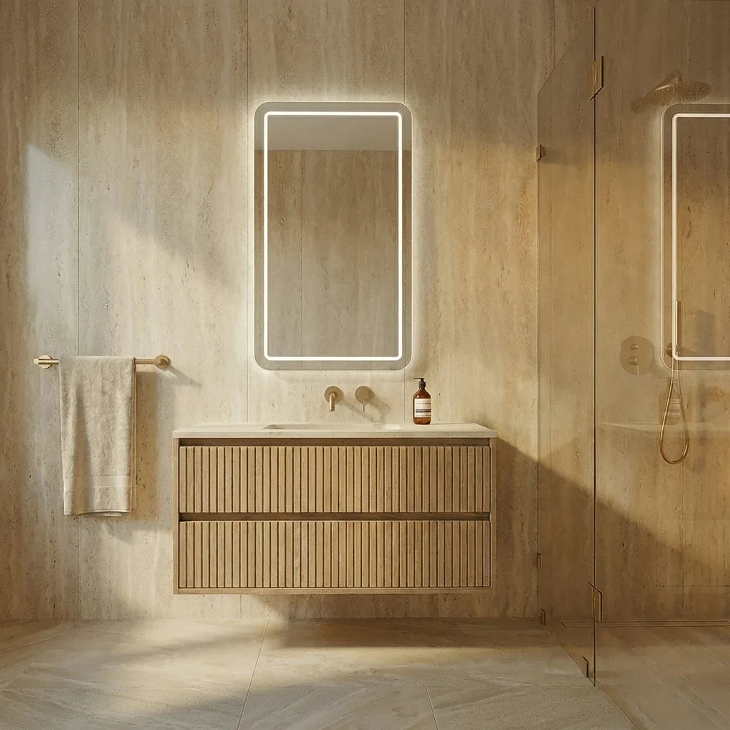 VITA LED mirror above a floating vanity in a travertine bathroom by Claris Company