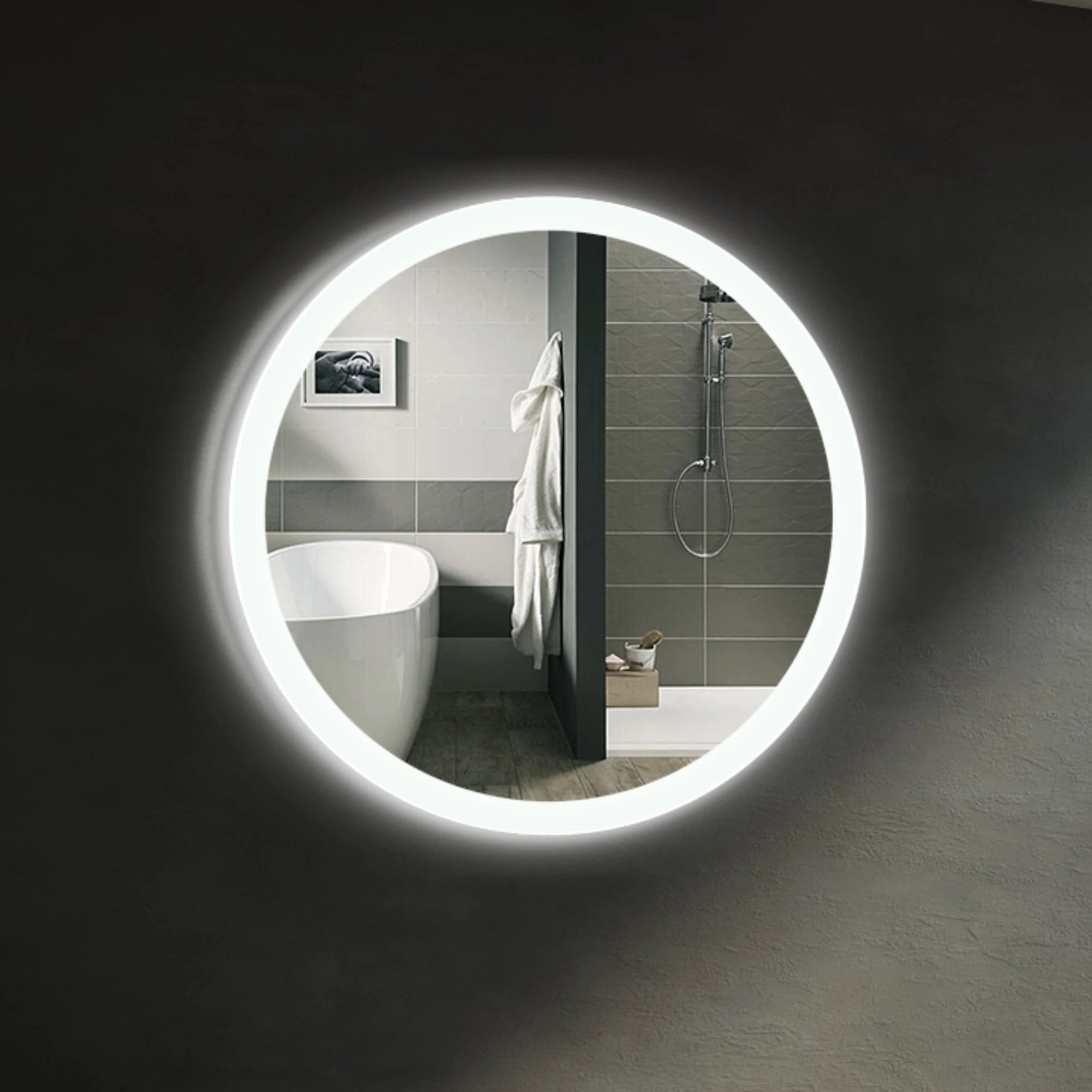 Sensa round LED bathroom mirror with a subtle ring of light. Claris Company.