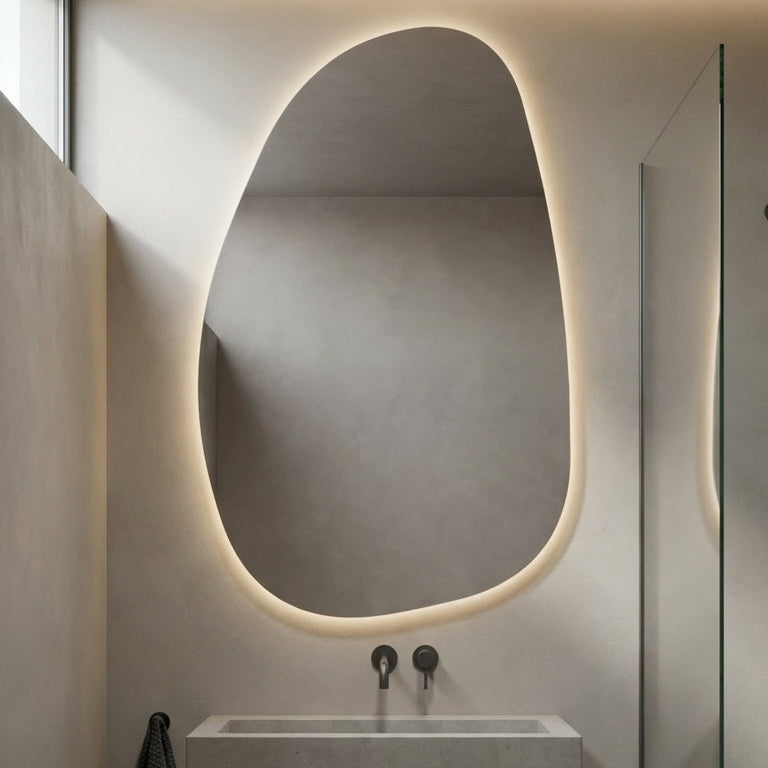 Modern bathroom with a sink and oval mirror with lighting