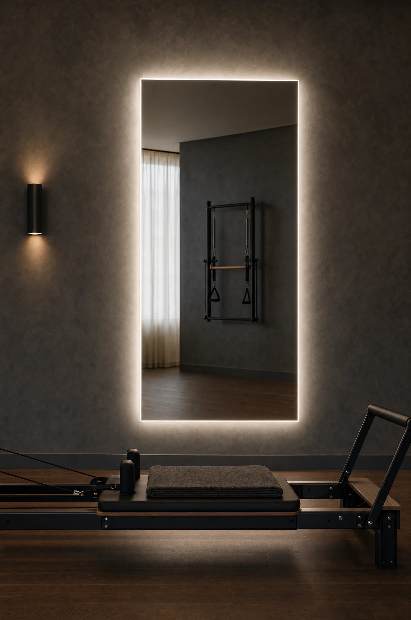 Claris ANIMA STUDIO large-format backlit mirror in a reformer pilates studio, Studio Line