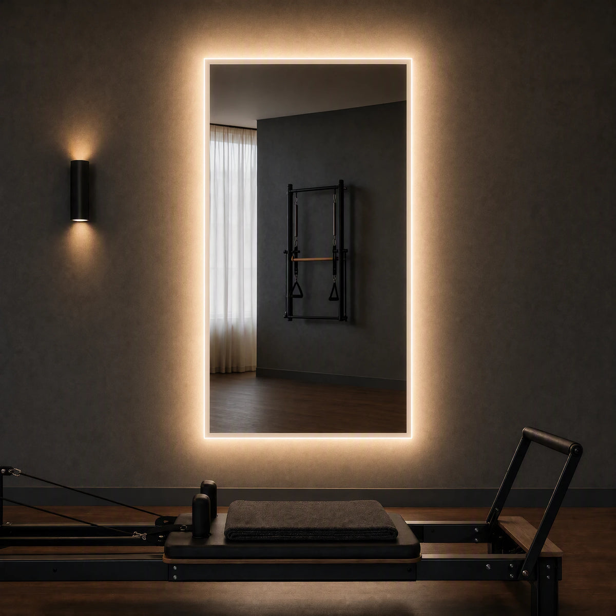 Claris ANIMA STUDIO large-format backlit mirror in a reformer pilates studio, Studio Line