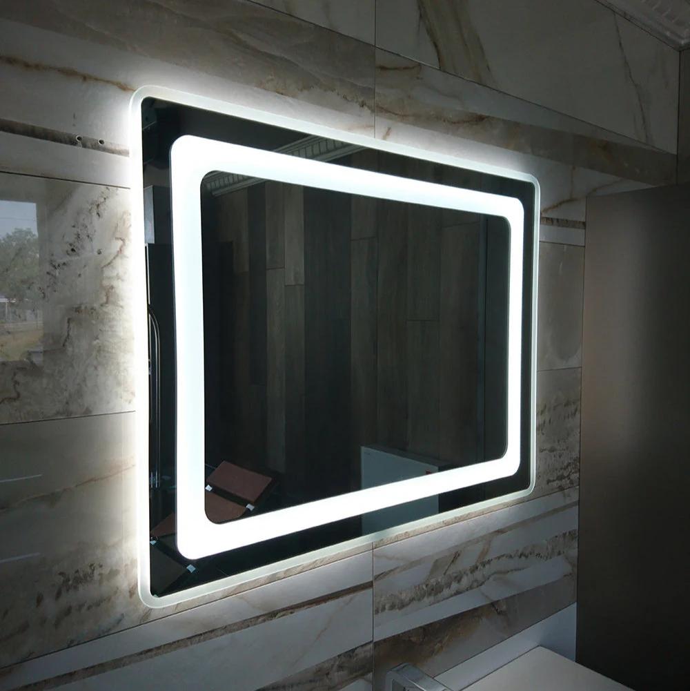 Valentino LED bathroom mirror with glowing frame and rounded corners. Claris Company.