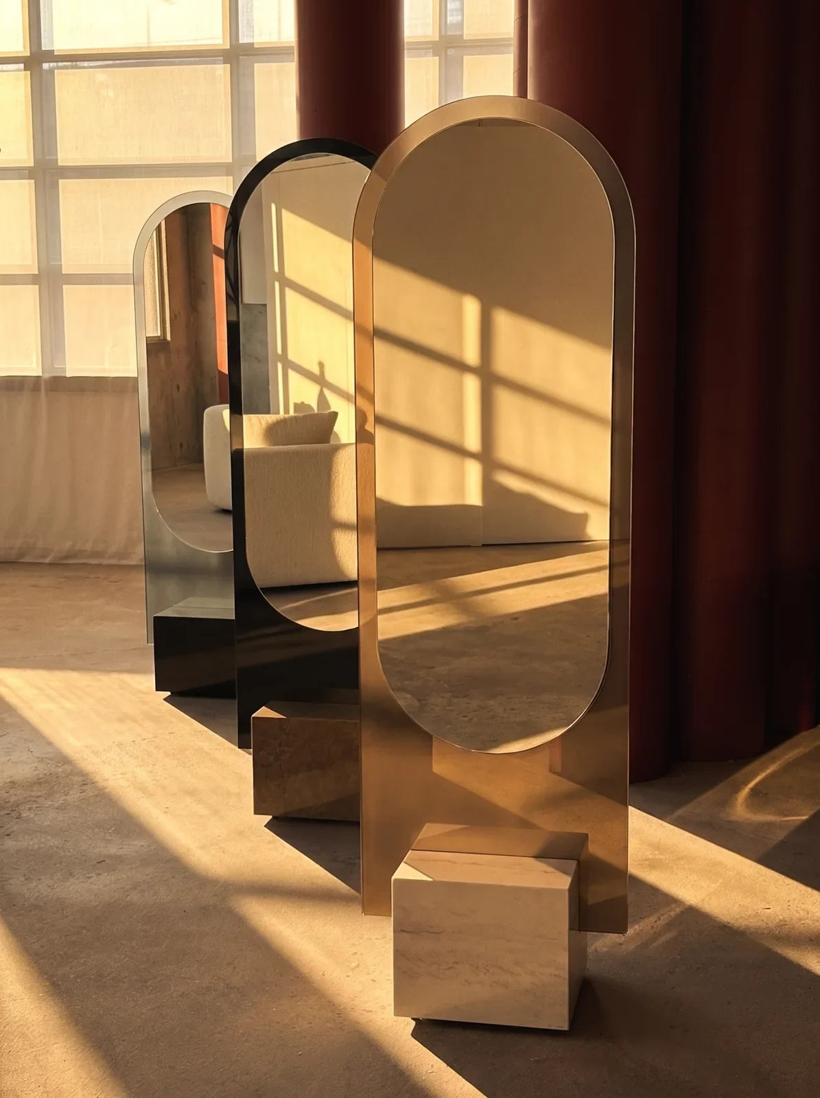 Three ALICE floor mirror sculptures by Benoît Gérard for Claris, in Bronze, Graphite and Black glass on Cosentino ĒCLOS bases