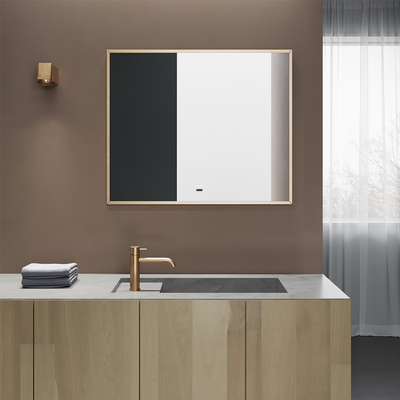 ORO Light mirror with sleek gold frame and modern design