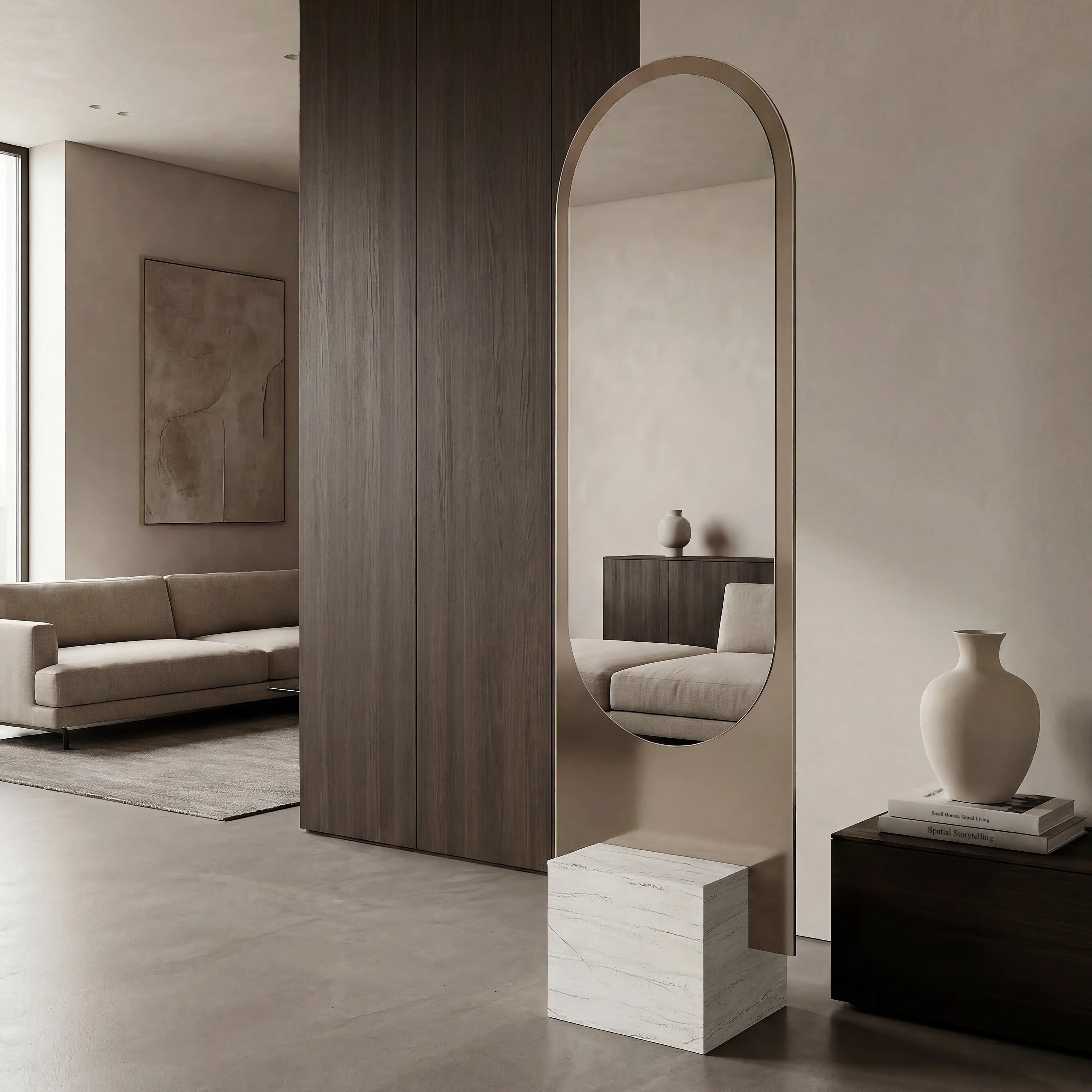 Modern interior with a standing mirror, sofa, and decorative items.