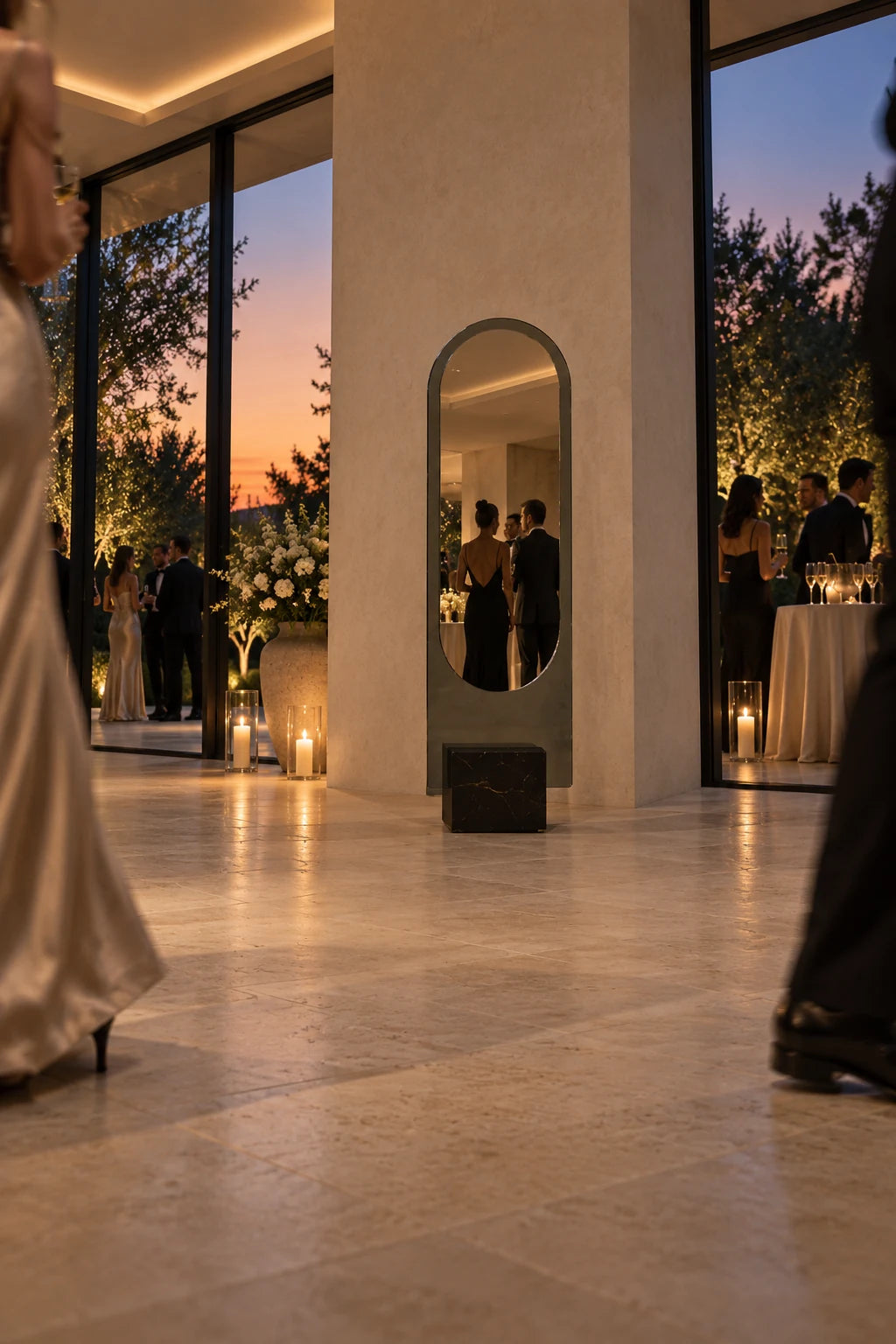 Claris ALICE floor mirror seen from low in a doorway at a summer gala, dusk beyond the glass