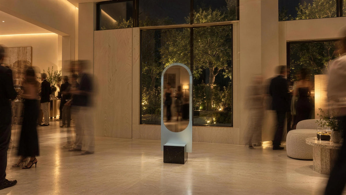 Claris ALICE floor mirror sharp among moving guests at a night party, long exposure, wide view