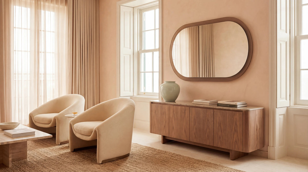 ALHENA single-aperture pill mirror in bronze frosted finish, residential lifestyle context. Claris Company.