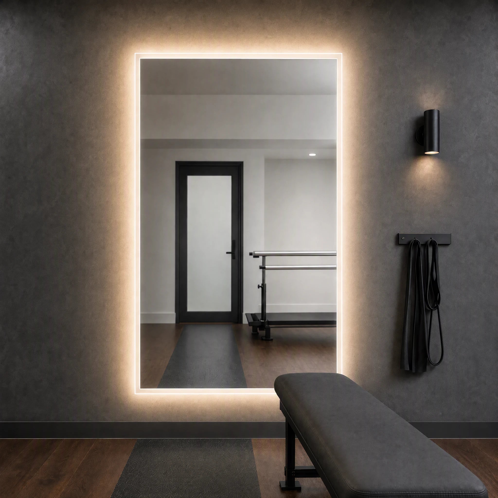 Claris ANIMA STUDIO large-format backlit mirror in a physiotherapy assessment room, Studio Line