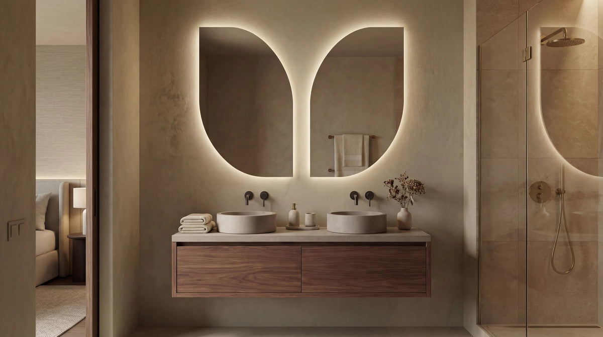 BUTTERFLY asymmetric wing-form mirror with LED backlight, residential lifestyle. Claris Company.
