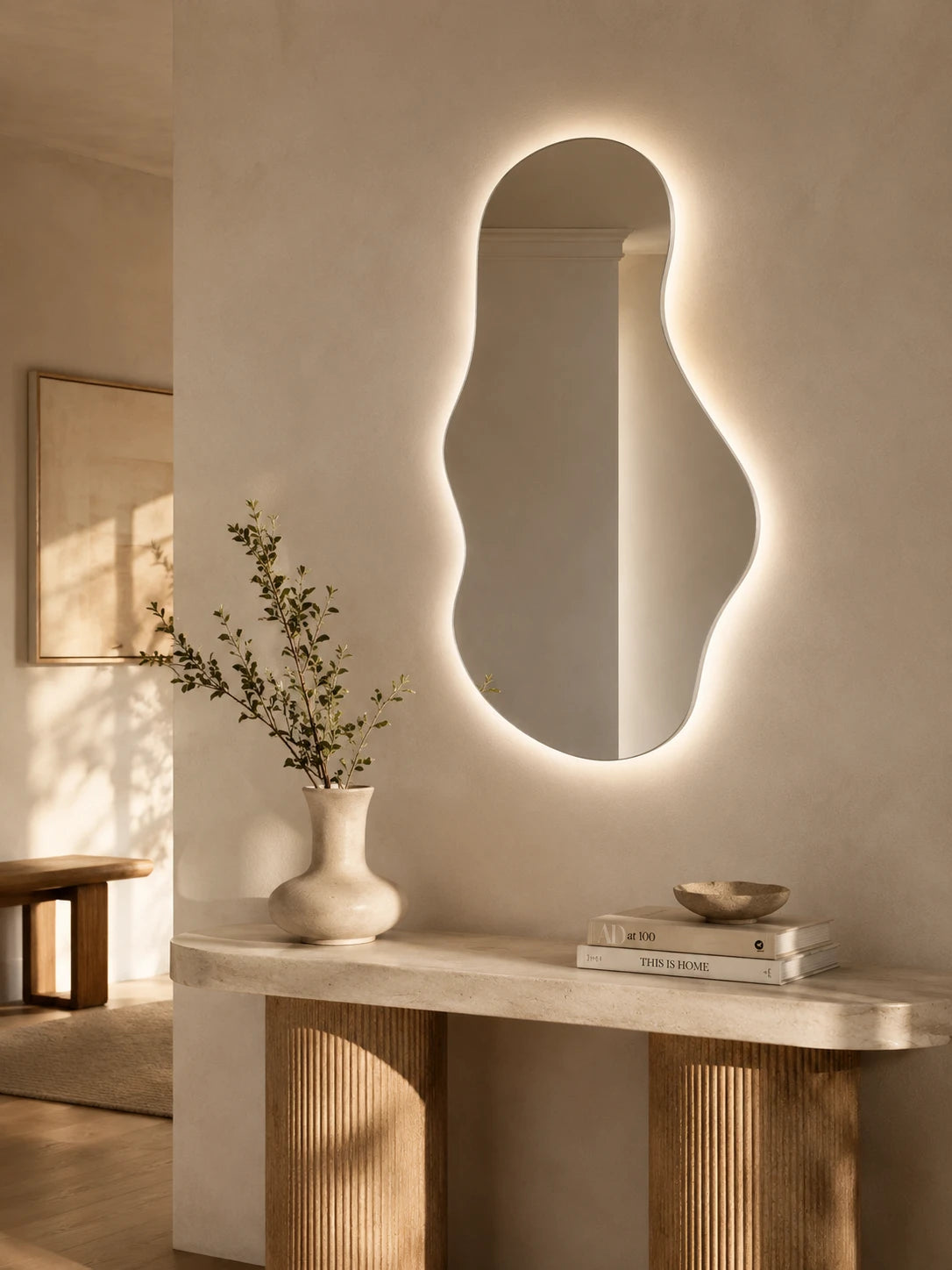 EMIRA mirror in a home-living interior, portrait view, Art Collection. Claris Company.
