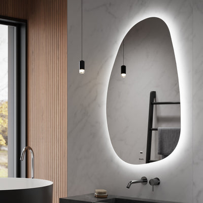 Modern bathroom with a black freestanding bathtub, oval mirror with LED lighting, and wooden vanity.
