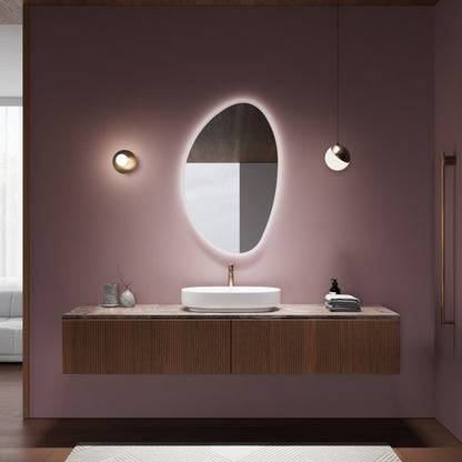 Wall-mounted PEBBLE mirror adding artistic elegance to any space