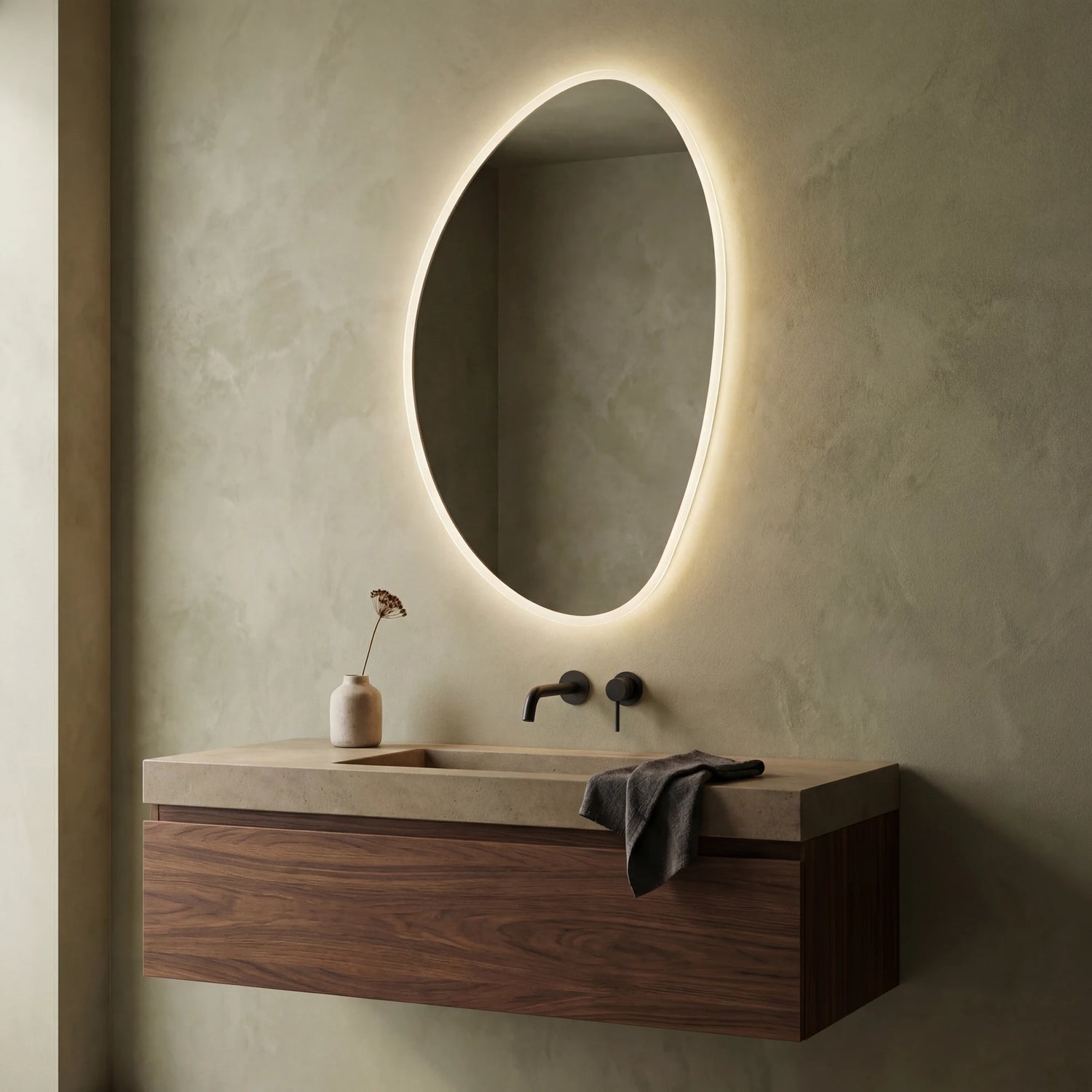 Claris PEBBLE asymmetric backlit LED bathroom mirror with river-stone silhouette, Terra Collection