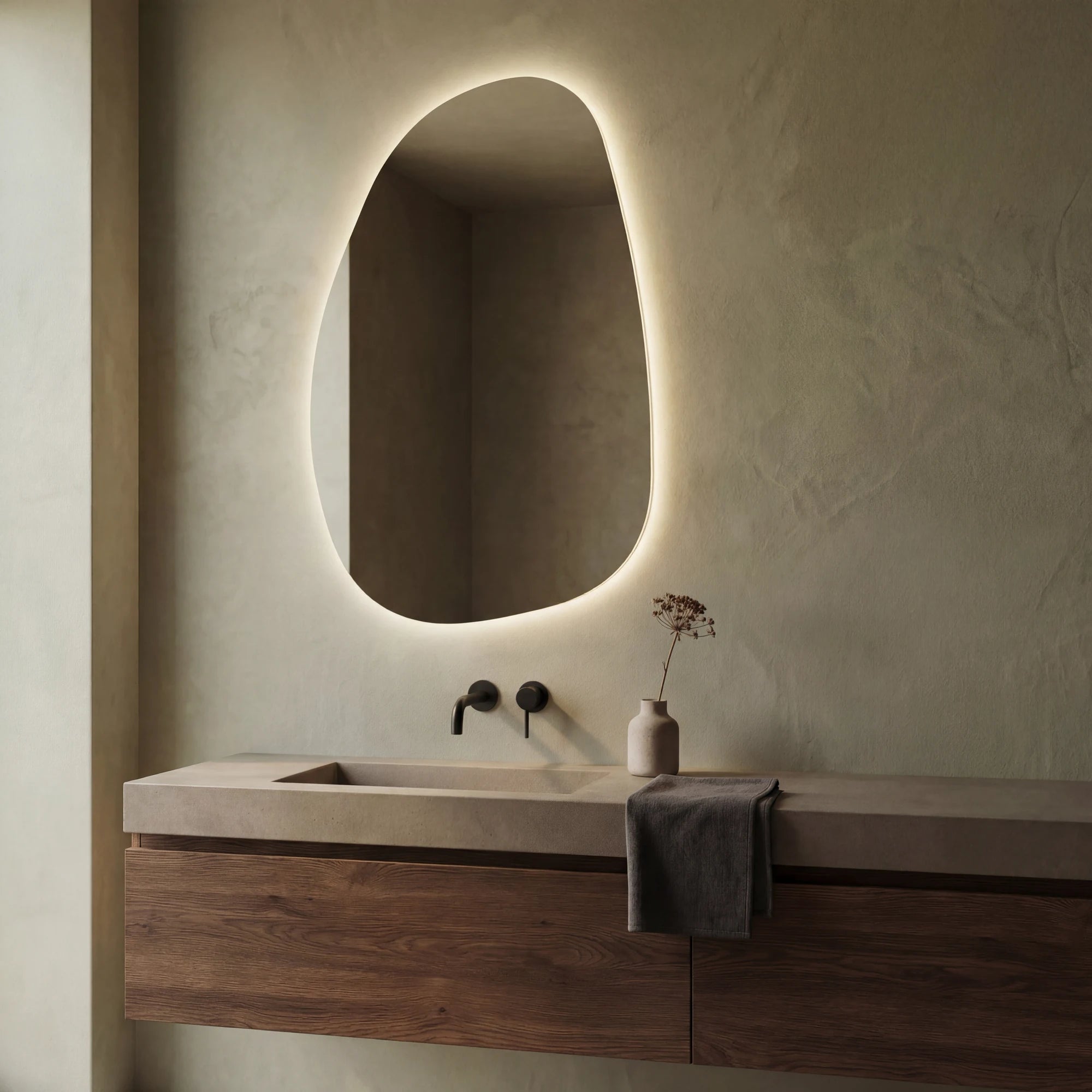 Claris STONE asymmetric backlit LED bathroom mirror with raw rock silhouette, Terra Collection